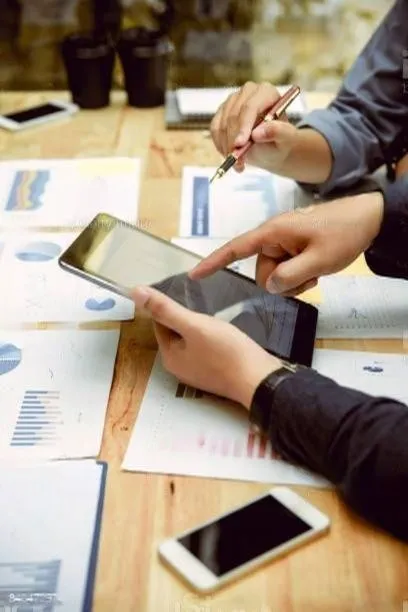 Advisor reviewing a company's financial reports on a tablet
